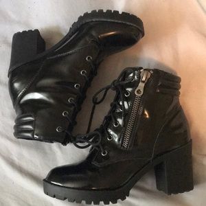 Black heeled patten leather boots